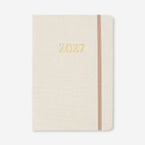 Flying Tiger Copenhagen A5 fabric cover daily diary 2027 in English, showing the textured fabric cover and compact office design.