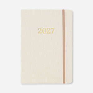 Flying Tiger Copenhagen A5 fabric cover daily diary 2027 in English, showing the textured fabric cover and compact office design.