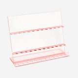 Clear cosmetic organizer for makeup brushes, 6x14x18 cm by Flying Tiger Copenhagen, showing multiple brush slots in a transparent design.