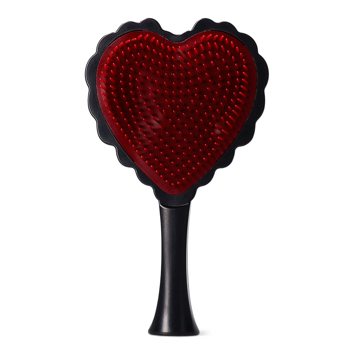 Red and black heart-shaped hairbrush from Flying Tiger Copenhagen, designed for personal care and hair detangling.