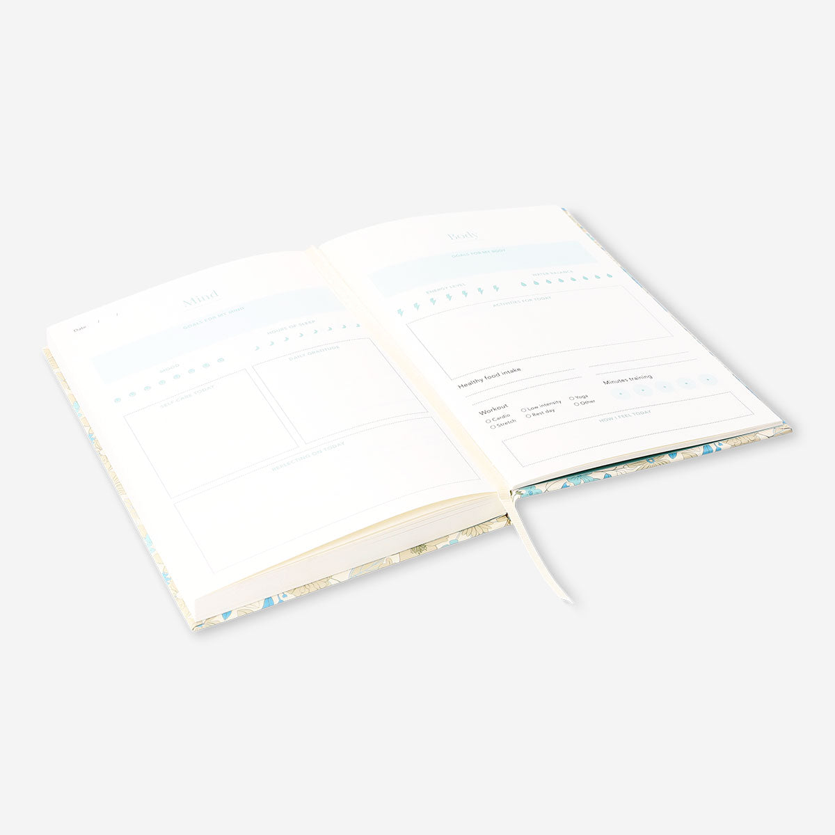 Flying Tiger Copenhagen floral wellness journal for office use, featuring colorful floral cover and lined pages for daily journaling.