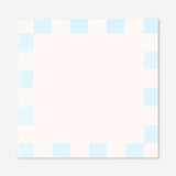 Blue chequered sticky memos for office use, branded Flying Tiger Copenhagen, shown in a close-up image with memos arranged neatly.