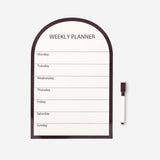 Magnetic weekly planner board with marker from Flying Tiger Copenhagen, featuring a clean office design with writable surface and magnetic sections.