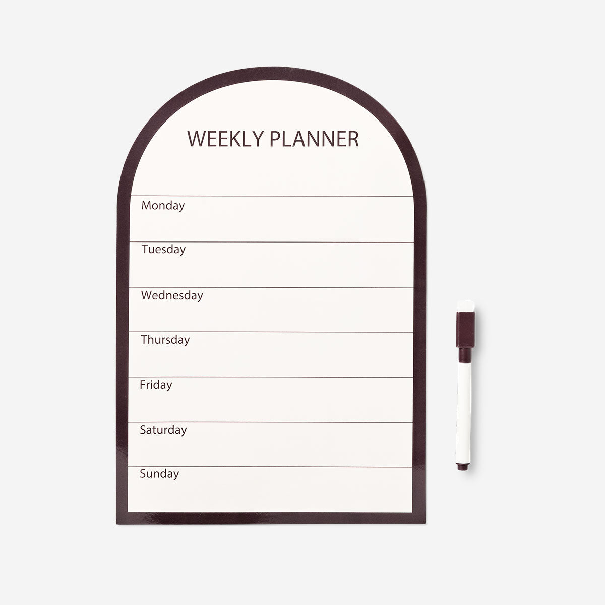 Magnetic weekly planner board with marker from Flying Tiger Copenhagen, featuring a clean office design with writable surface and magnetic sections.