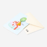 Office birthday card featuring a colorful balloon with tassel attachment from Flying Tiger Copenhagen, displayed on a plain background.