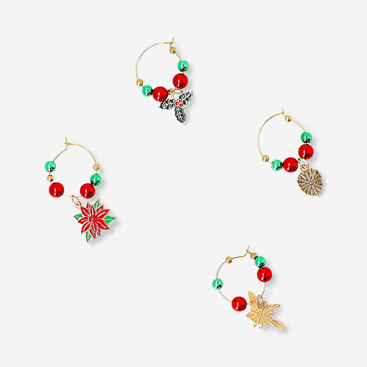 Set of four Flying Tiger Copenhagen wine glass Christmas decorations for kitchen, featuring festive holiday designs.