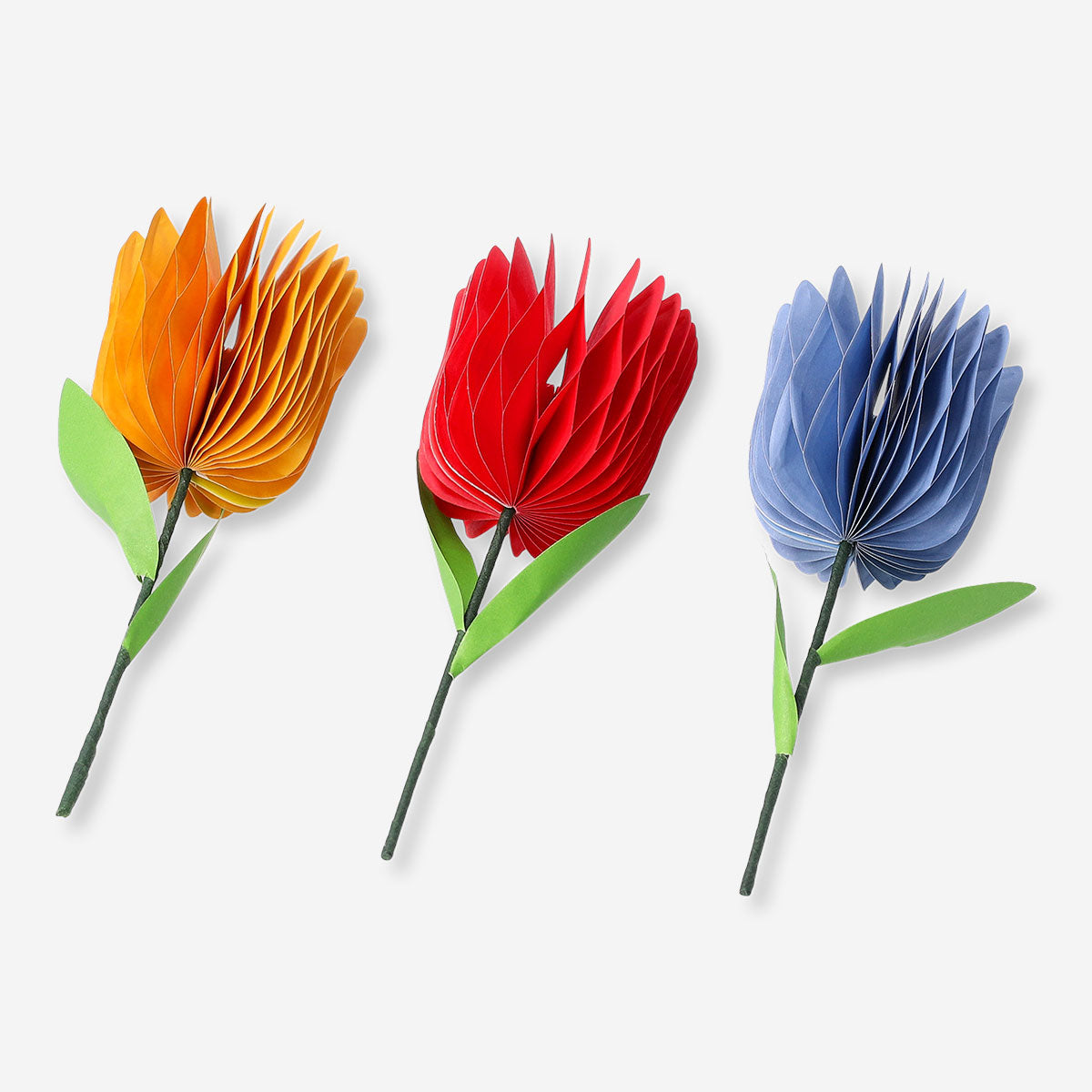 Three honeycomb paper flower decorations for party, colorful and textured, by Flying Tiger Copenhagen.
