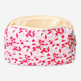 Quilted floral toiletry bag by Flying Tiger Copenhagen, with zipper closure and compact design for personal care essentials.