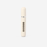 Beige 8ml refillable travel perfume bottle by Flying Tiger Copenhagen, compact and stylish for on-the-go fragrance.