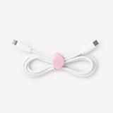 Set of four pink media cable organizers by Flying Tiger Copenhagen, neatly arranged to keep cables tidy and tangle-free.