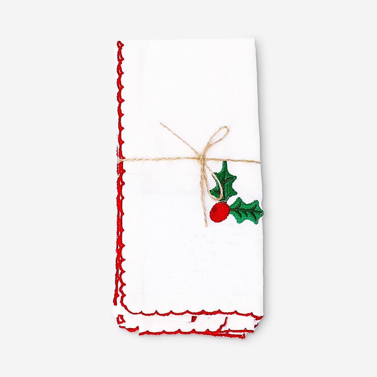 Pair of fabric napkins with holly embroidery from Flying Tiger Copenhagen for home decor, featuring festive red and green holly design.