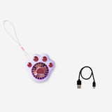 Purple handheld fan gadget with paw design from Flying Tiger Copenhagen, compact and portable for on-the-go cooling.