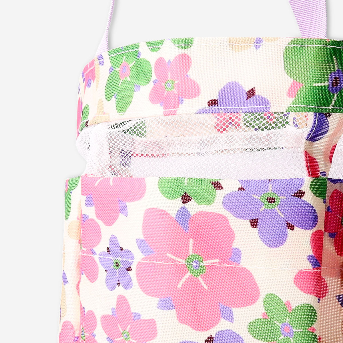 Floral hanging bathroom organizer by Flying Tiger Copenhagen with multiple pockets for bathroom essentials.