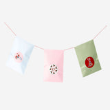 Set of 24 Flying Tiger Copenhagen Advent gift bags with numbered stickers, ideal for holiday gift wrapping and office use.