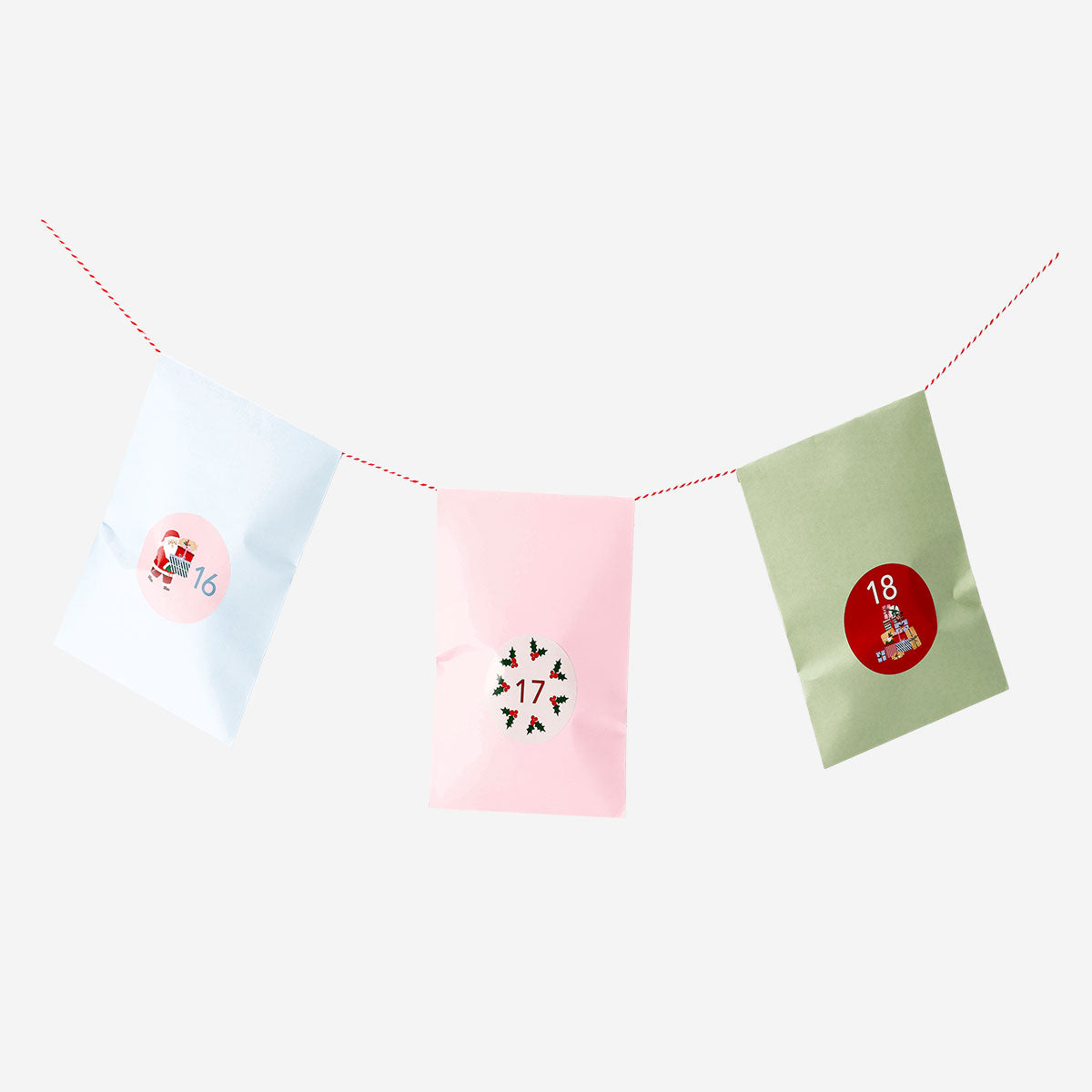 Set of 24 Flying Tiger Copenhagen Advent gift bags with numbered stickers, ideal for holiday gift wrapping and office use.