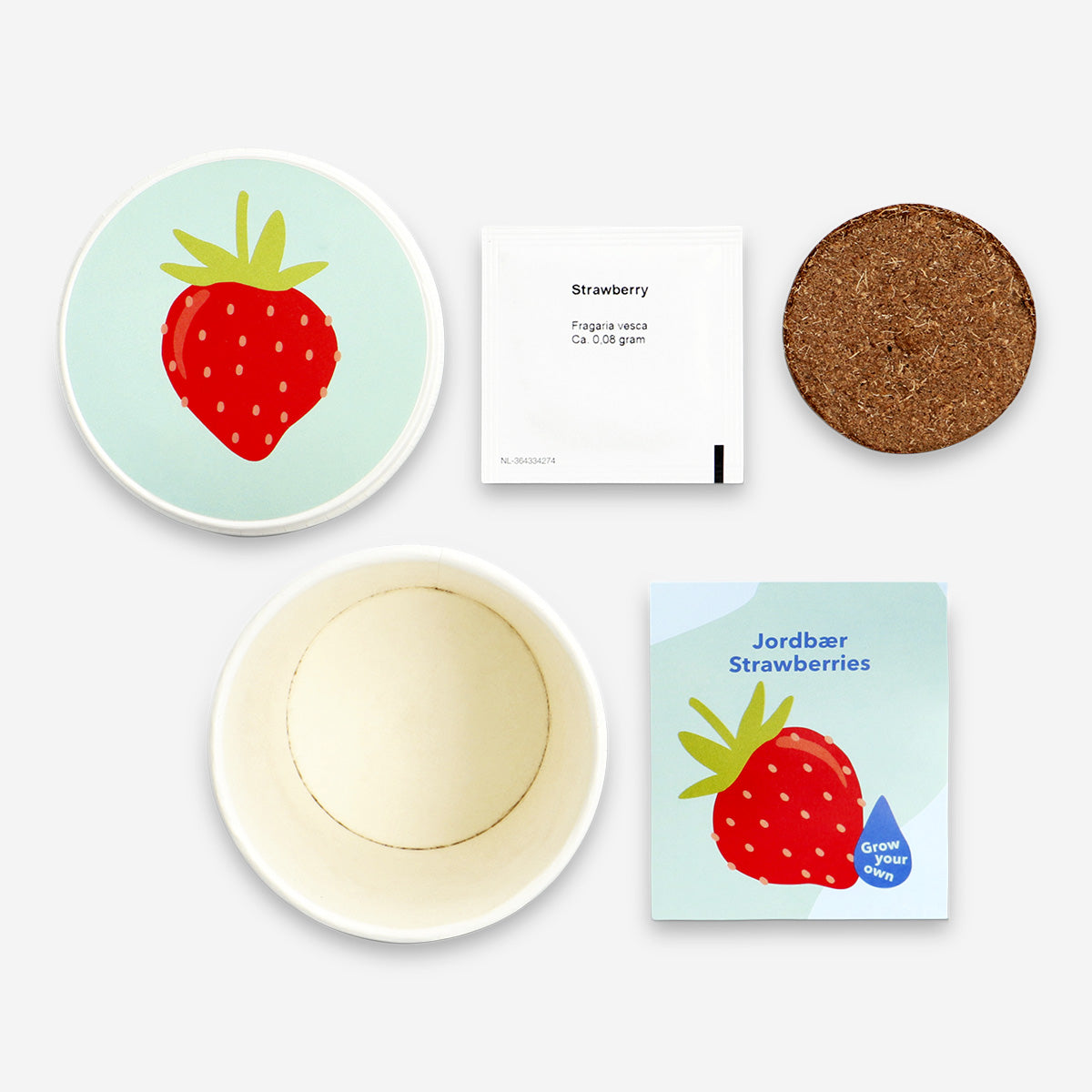 Flying Tiger Copenhagen strawberry grow kit for home, featuring small plant pots and strawberry seedlings ready for planting.