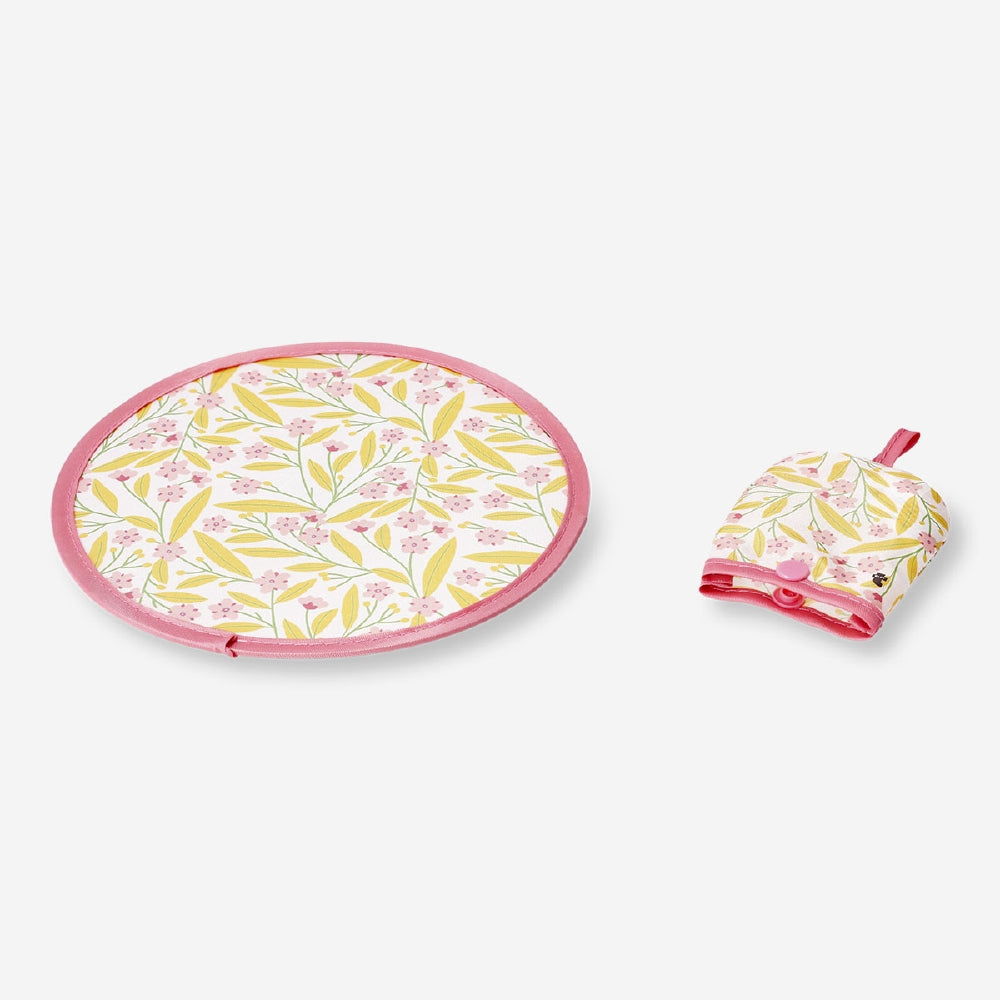 Foldable textile fan with colorful flower print by Flying Tiger Copenhagen, showcasing its compact, portable design.
