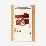 DIY wooden gingerbread house hobby kit by Flying Tiger Copenhagen featuring assembled wooden pieces for creative craft projects.