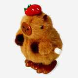 Wind up capybara with strawberry hat