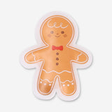 Flying Tiger Copenhagen gingerbread man pocket heat pad gadget, showing its cute gingerbread shape and soft fabric design.