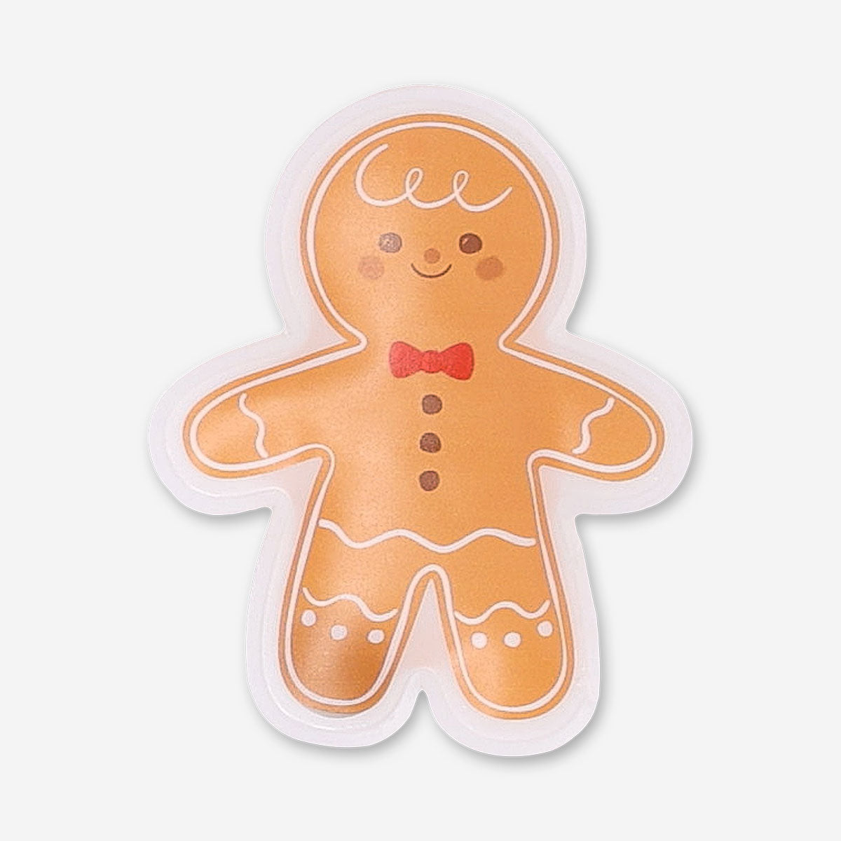 Flying Tiger Copenhagen gingerbread man pocket heat pad gadget, showing its cute gingerbread shape and soft fabric design.