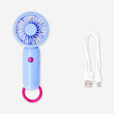 Flying Tiger Copenhagen handheld blue gadget fan with three adjustable speed settings, compact and portable for cooling on the go.
