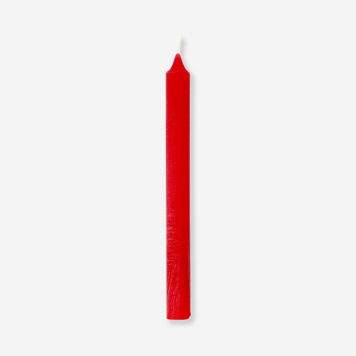 Red dinner candle from Flying Tiger Copenhagen, 24 cm tall, shown burning in a home setting.