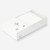 Set of 10 white dinner candles from Flying Tiger Copenhagen, arranged on a table for home dining ambiance.