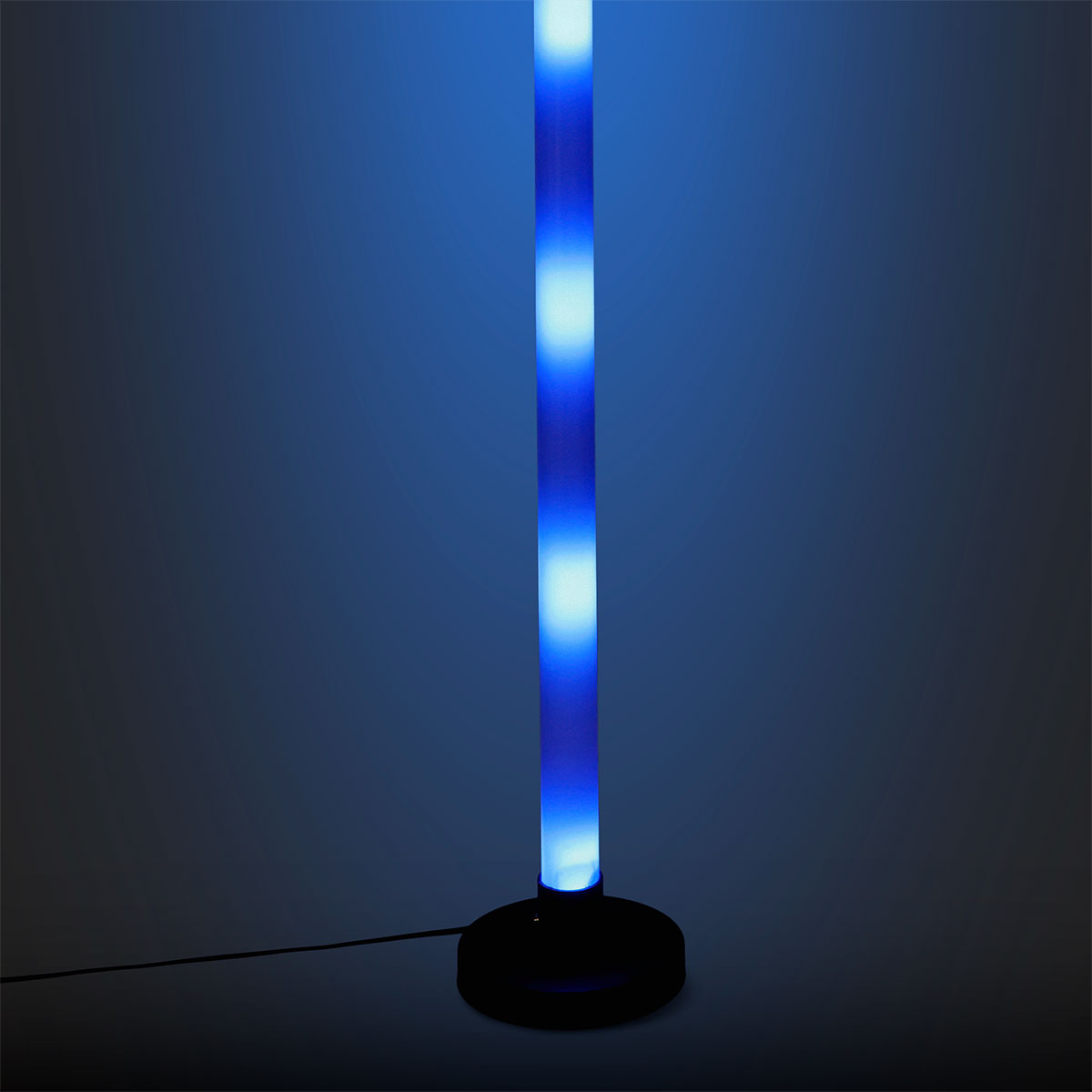 Color changing LED tube gadget by Flying Tiger Copenhagen, illuminated with vibrant rainbow colors in a close-up shot.