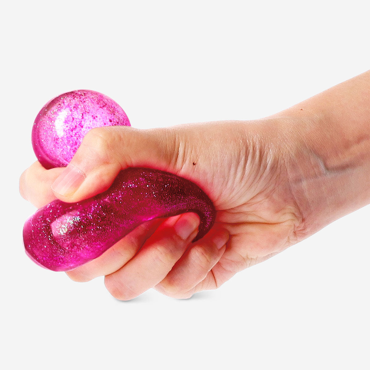 Pink Flying Tiger Copenhagen Press Me toy, a heart-shaped fidget gadget designed for sensory fun and stress relief.