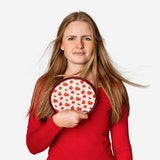 Foldable textile fan with blood orange print by Flying Tiger Copenhagen, showing colorful, lightweight design and compact folding feature.