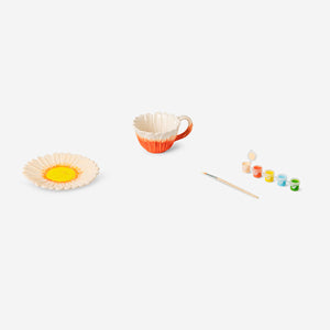 DIY ceramic flower mug with saucer from Flying Tiger Copenhagen, featuring colorful flower design and handle for crafting fun.