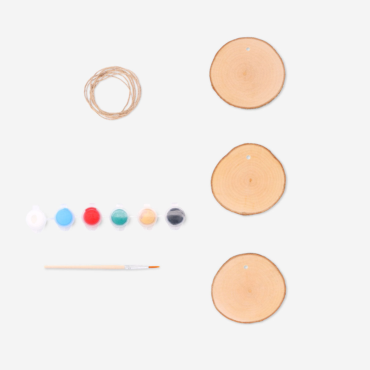 Set of three DIY wooden ornaments from Flying Tiger Copenhagen, showcasing natural wood textures for craft projects.