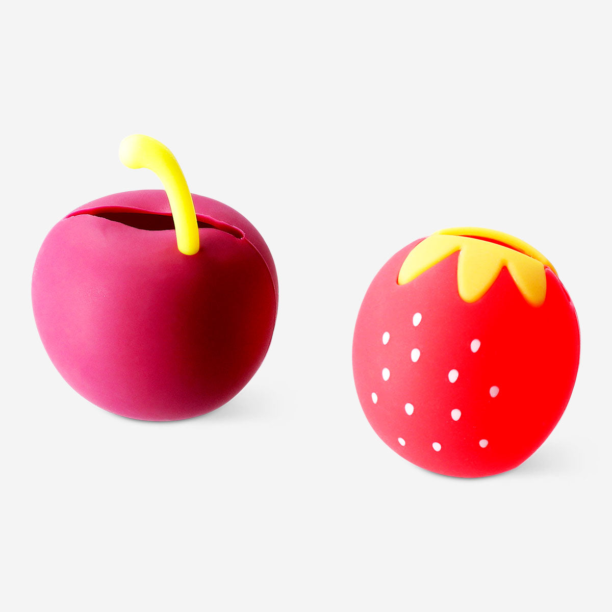 Two makeup brush covers shaped like berries from Flying Tiger Copenhagen, protecting brushes in a colorful, berry-themed design.