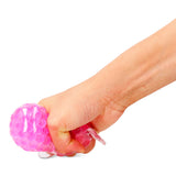 Pink press me toy gadget by Flying Tiger Copenhagen, hard candy with cooling effect, colorful and fun sensory stress reliever.