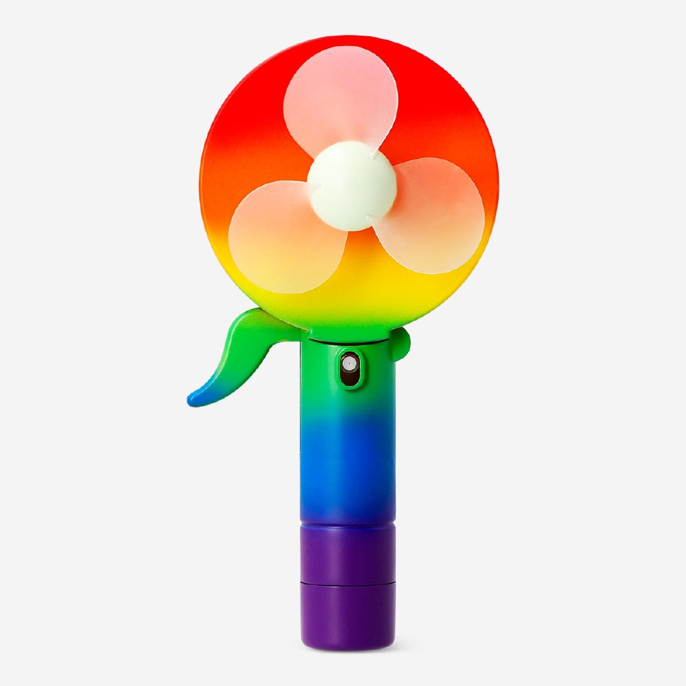 Rainbow coloured handheld fan gadget by Flying Tiger Copenhagen with vibrant rainbow stripes and compact design.