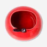 Red ceramic apple-shaped pencil holder for office use, by Flying Tiger Copenhagen, with a glossy finish and realistic apple details.