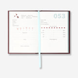 A6 Flying Tiger Copenhagen wine-tasting journal in English, featuring pages for recording wine notes, with a sleek office design.