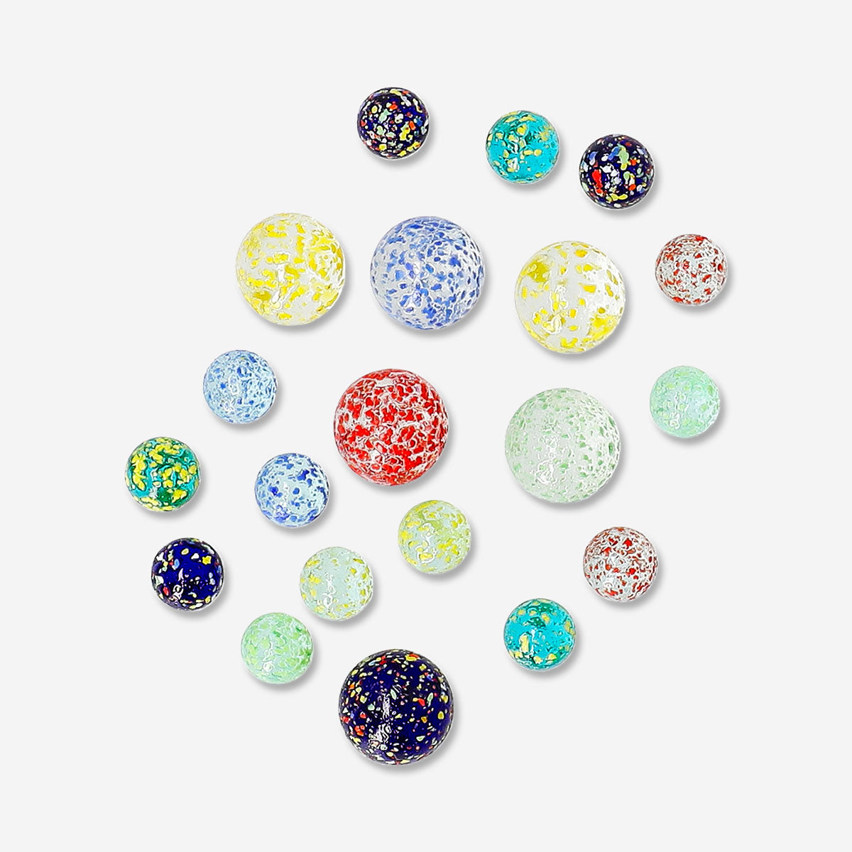 Colorful glass marbles in a box, toy by Flying Tiger Copenhagen, featuring shiny, translucent spheres for children’s play.
