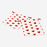 Two heart print drawstring gift bags for office use, featuring Flying Tiger Copenhagen branding and convenient drawstring closure.