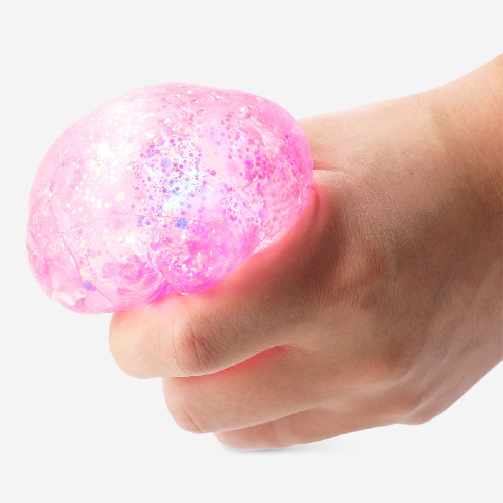 Pink bubble square fidget cube by Flying Tiger Copenhagen, featuring tactile bubbles for stress relief and sensory engagement.