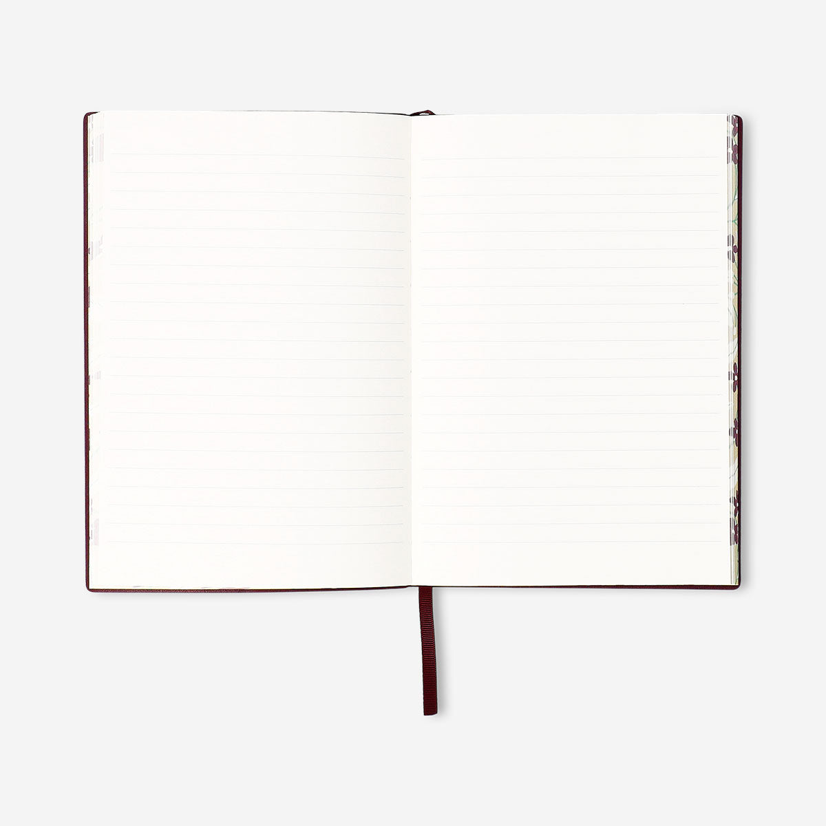 Burgundy office notebook with printed text, branded by Flying Tiger Copenhagen, open showing lined pages inside.