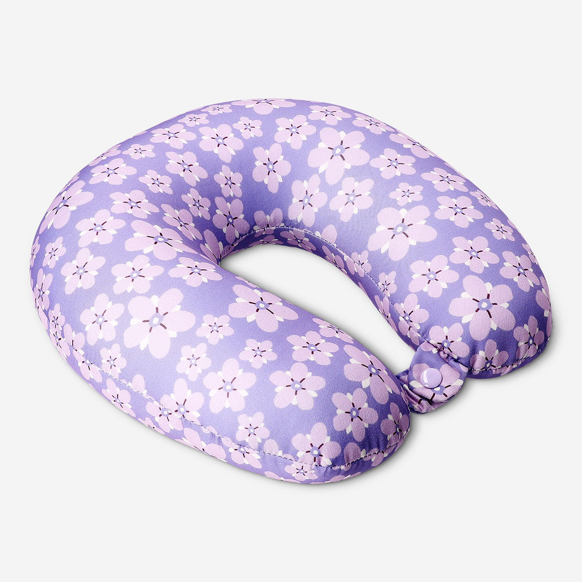 Purple floral leisure travel pillow by Flying Tiger Copenhagen, soft fabric with vibrant floral pattern for comfortable travel.
