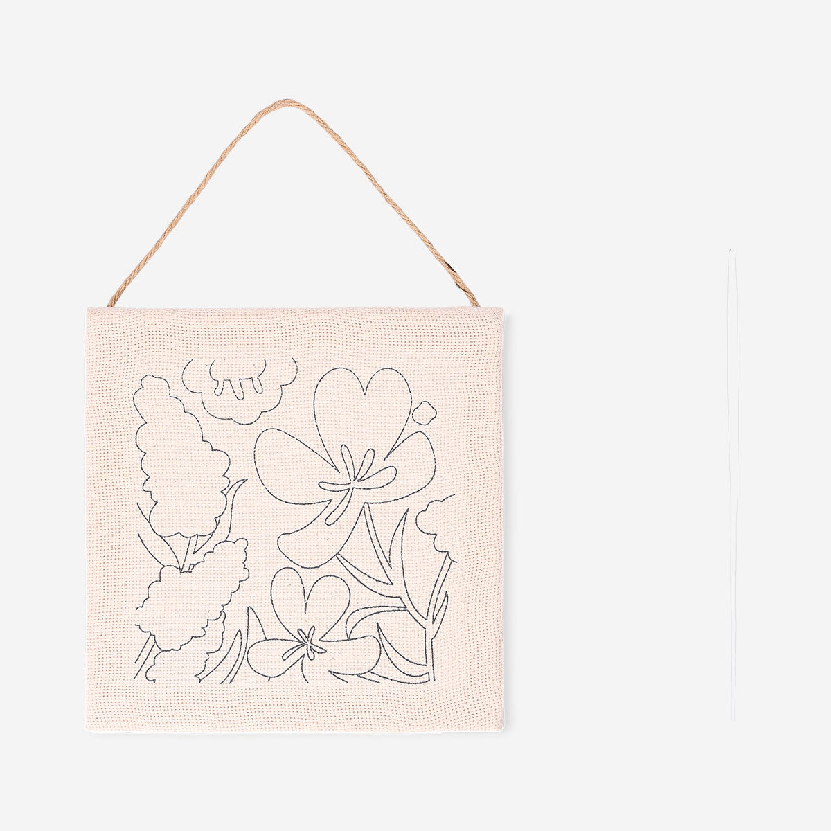 Flying Tiger Copenhagen punch needle set for floral wall art, featuring colorful embroidery tools and floral patterns for crafting.