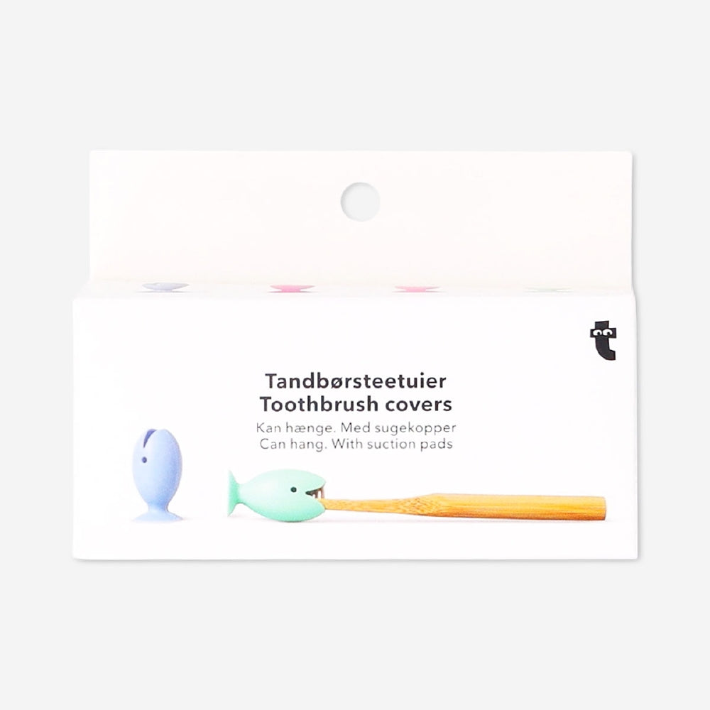 Set of four Flying Tiger Copenhagen fish-shaped toothbrush covers with suction pads, perfect for bathroom organization.