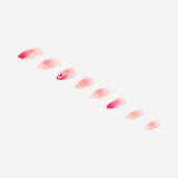 Pink press-on nails with pearl embellishments, designed for personal care by Flying Tiger Copenhagen.