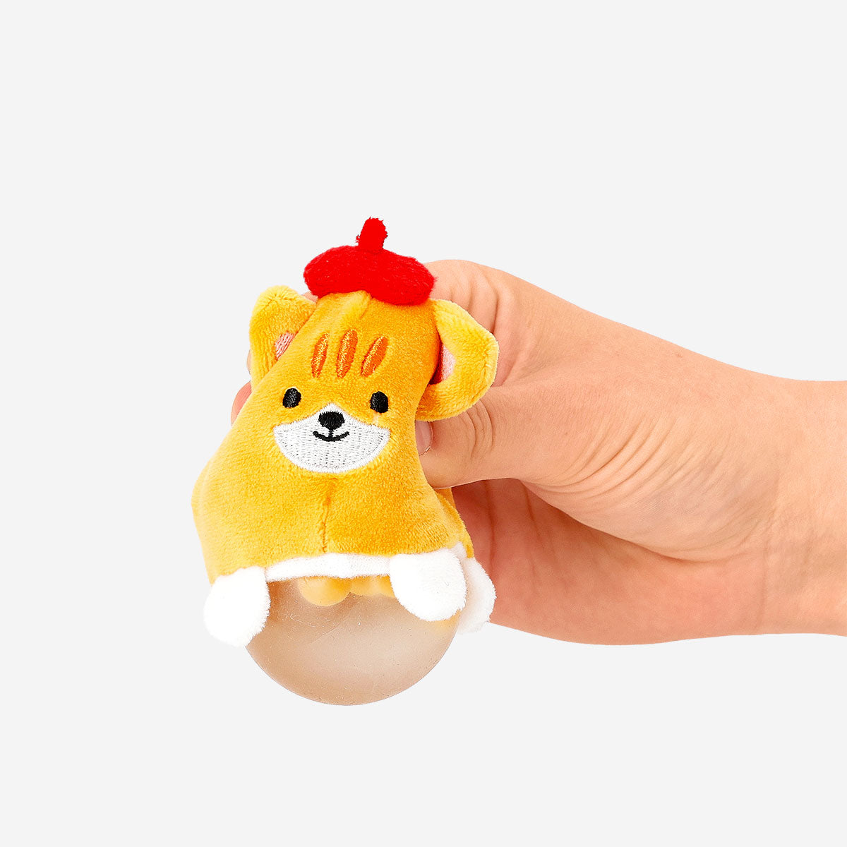 Press me toy featuring a cute tabby cat design from Flying Tiger Copenhagen, a fun gadget with a colorful, textured surface.