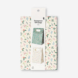 Two Christmas print gift bags for office gifts by Flying Tiger Copenhagen, featuring festive holiday designs.