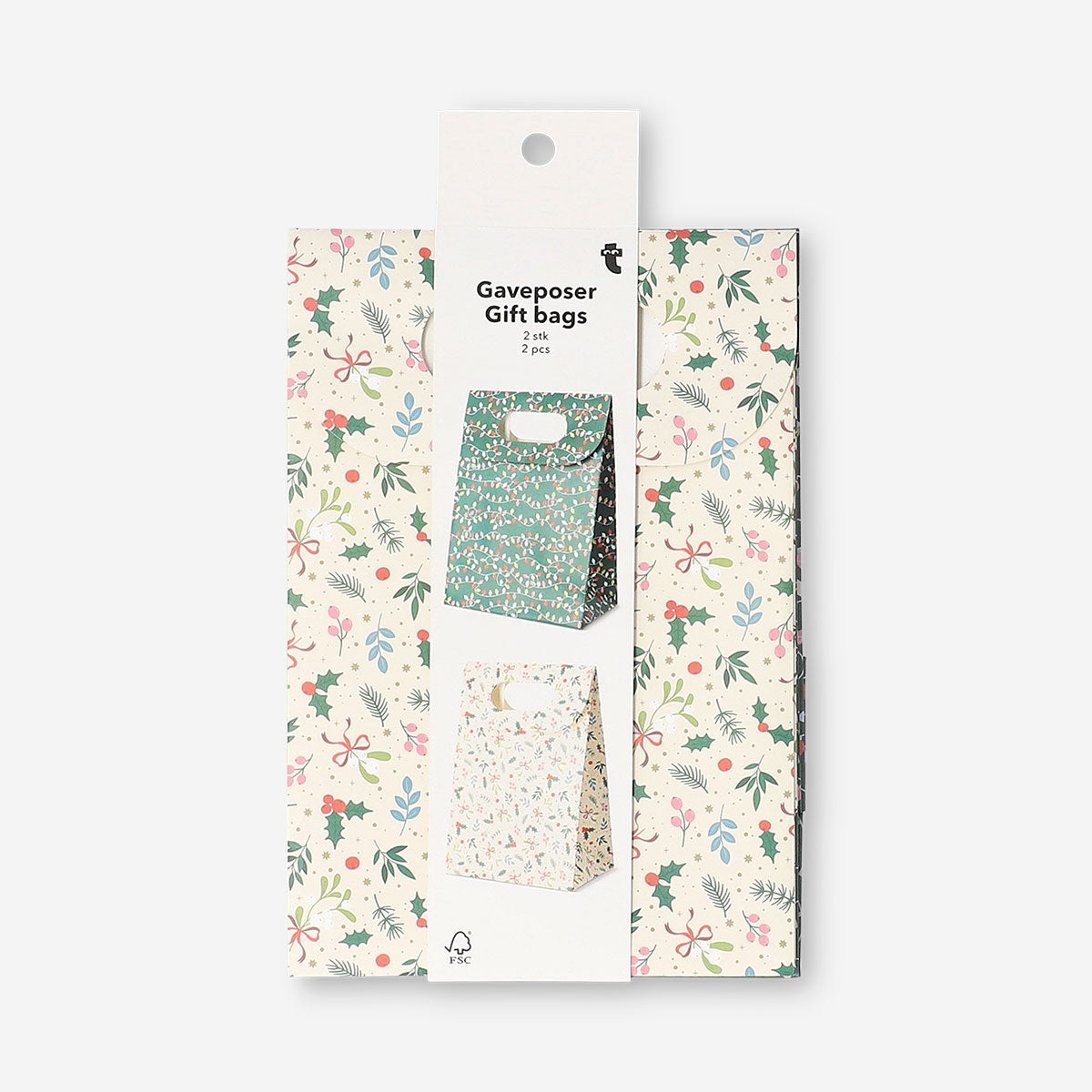 Two Christmas print gift bags for office gifts by Flying Tiger Copenhagen, featuring festive holiday designs.