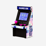 Flying Tiger Copenhagen mini arcade gadget with 100 built-in classic games, featuring colorful buttons and compact design.